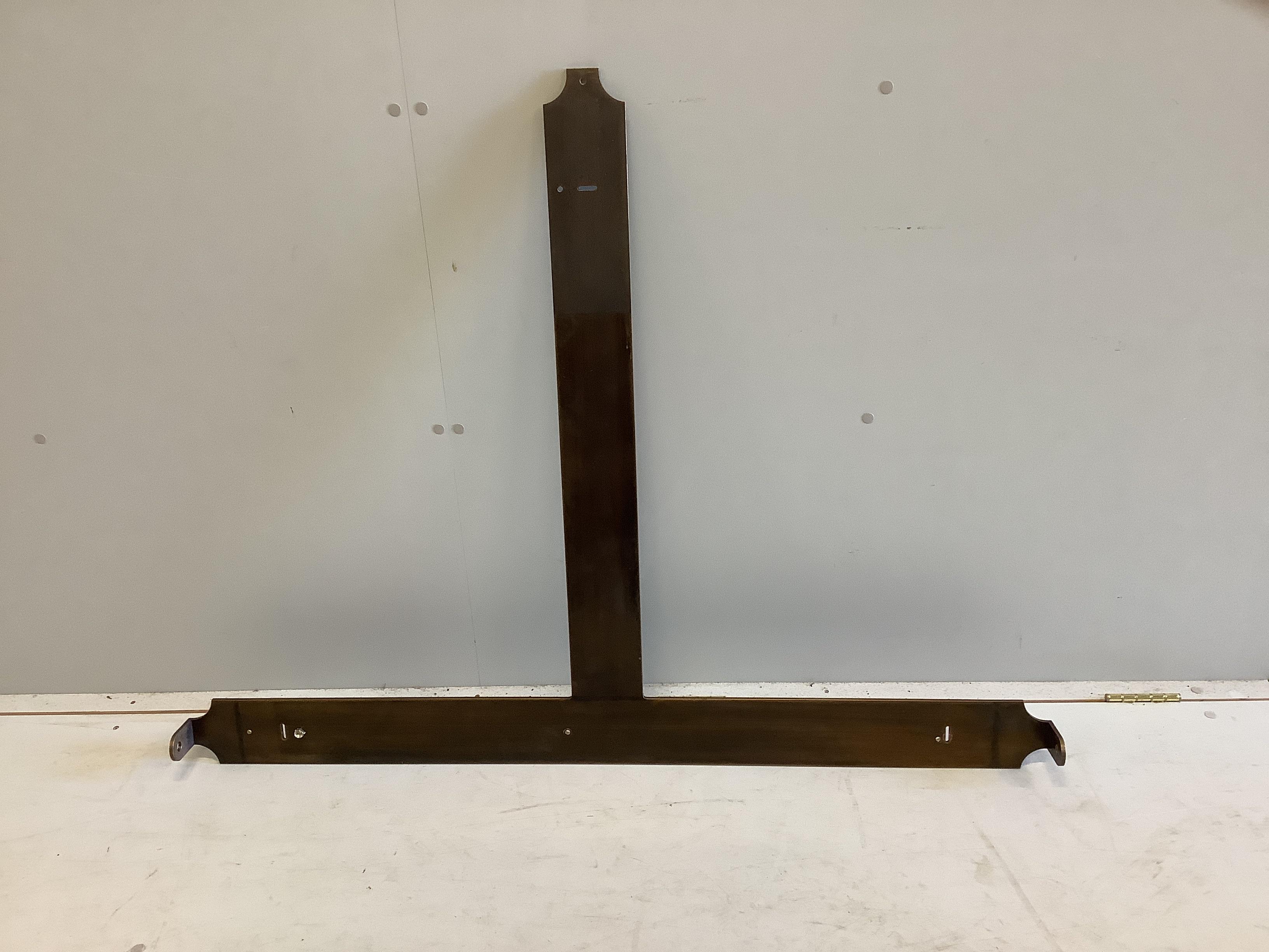 A large bespoke oval brass mounted mahogany mirror by Archer and Smith, width 118cm, height 179cm and metal wall bracket